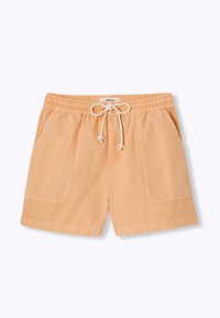 Shorts de couleur pêche fabriqués en coton, avec une taille élastique, un cordon de serrage ajustable et deux poches latérales. Texture lisse, design décontracté.