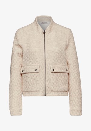 Veste matelassée beige clair avec un col haut, une fermeture éclair sur le devant, deux poches à rabat et une texture géométrique subtile sur le tissu.