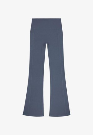 Leggings grigi con fondo svasato in un tessuto texturizzato, vita alta e cuciture a contrasto. Presentano tasche sui lati.