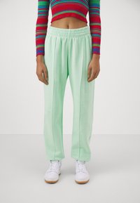 Nike Sportswear - PANT - Tracksuit bottoms - vapor green/black Thumbnail Image 1