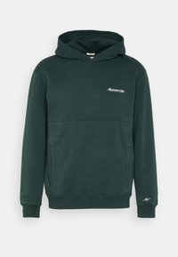 Hoodie vert en tissu doux, avec une poche kangourou, des poignets côtelés et un petit logo blanc sur la poitrine. Coupe classique avec capuche.