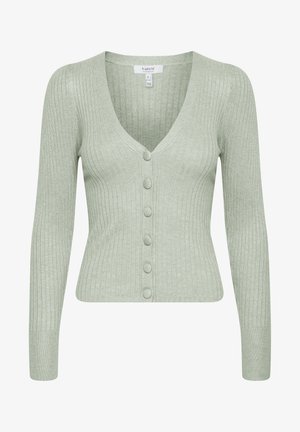 Viheribattu neulejakku V-pääntie, pitkät hihat ja kuusi nappia edessä, valmistettu pehmeästä kankaasta, jossa on tekstuuripinta.