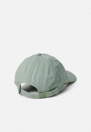 Light green baseball cap made of fabric with a curved bill, adjustable back strap, and a small embroidered logo on the side.
