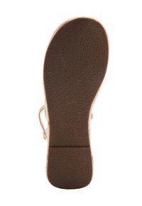 Brun gummisula med strukturerad, halkfri yta, rund form och tvåfärgad design med detaljerade mönster på sulan.