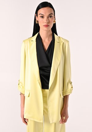 Halflange jas - giallo chiaro