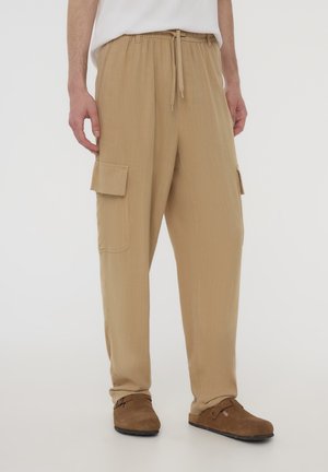 Pantaloni cargo - beige chiaro