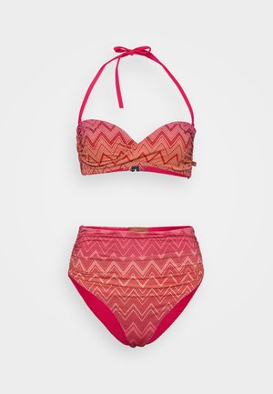Bikini set featuring a strapless top with chevron pattern in shades of red and pink, paired with high-waisted bottoms matching the design.