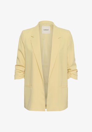 Blazer femme jaune clair avec manches trois-quarts froncées, revers crantés et poches passepoilées devant, étiquette « soaked » à l’intérieur du col.