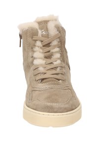 Beige suede high-top sneaker with faux fur collar, flat laces, side zipper, and a textured rubber outsole for grip and durability.