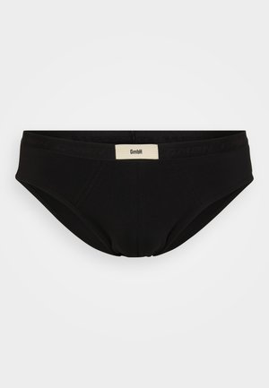 Boxers noirs pour hommes en tissu lisse, dotés d'une taille douce avec l'étiquette de la marque bien en évidence à l'avant.