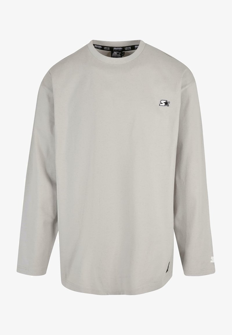 Helles graues Langarm-T-Shirt aus Baumwolle. Es verfügt über einen Rundhalsausschnitt, ein kleines Logo auf der Brust und Nähdetails am Saum.