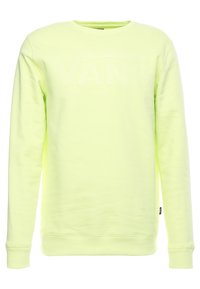 Jasnożółta sweatshirt z długimi rękawami marki Vans z dekoltem w serek, z subtelnym wytłoczonym logo Vans na piersi.