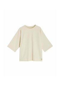 T-shirt en coton beige à manches courtes avec un col rond et une coupe décontractée. Présente un petit logo en bas à gauche.