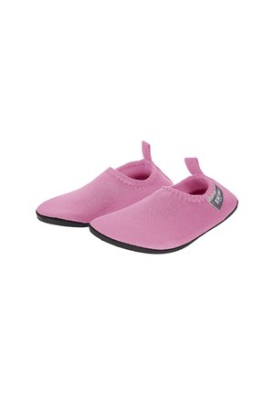 Soft pink slip-on water shoes with black soles and pull tabs at the heels, designed for easy wear and comfort.