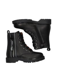 Bottes de combat en cuir noir avec zip sur le côté, lacets et semelles en caoutchouc épaisses, placées côte à côte sur un fond blanc.