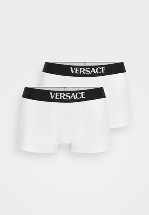 Boxers en coton blanc avec une ceinture élastique noire arborant le logo "Versace" en blanc, texture lisse et design ajusté.