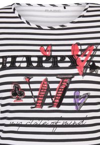 Striped t-shirt in black and white with colorful printed text "HAPPY" and stylized hearts. Features sequin accents and a crew neckline.