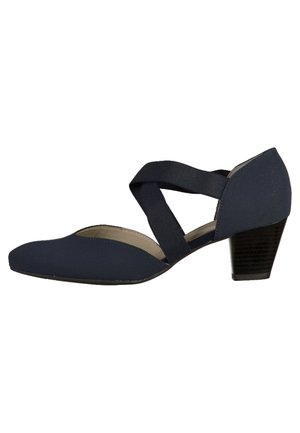 Navy blue heeled shoe with a soft fabric upper, cross-strap design, pointed toe, and a textured block heel. Smooth interior lining.