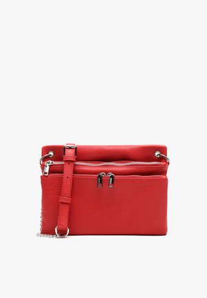 Red leather crossbody bag featuring two zippered pockets, adjustable strap, and metallic hardware accents. Textured surface adds detail.