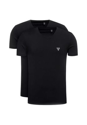 Deux t-shirts noirs unis à manches courtes avec col rond, l'un derrière l'autre, avec un petit logo triangulaire blanc sur la poitrine.