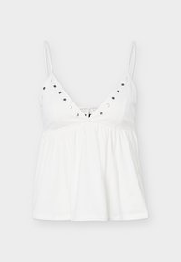 Λευκό γυναικείο τοπ χωρίς μανίκια με λεπτές τιράντες, V-λαιμόκοψη, ασημένια διακοσμητικά καρφιά κατά μήκος της λαιμόκοψης και συγκεντρωμένη, φαρδιά μέση.