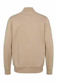 Béžová mikina s vysokým golierom a rebrovanými manžetami. Hladká textúra s jednoliatou farbou, na spodnej ľavej časti rukáva je umiestnený logový akcent.