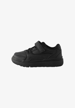 Black athletic shoe with synthetic upper, padded collar, and hook-and-loop strap. Features perforated design and textured rubber sole for grip.