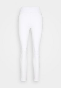 Leggings blancos hechos de material elástico con una cinturilla alta, que presentan detalles desgastados en las rodillas y un diseño ajustado.