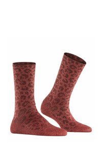 Calze rosse glitter con design a stampa leopardata; lunghezza a metà polpaccio, texture morbida e zone rinforzate sulla punta e sul tallone.