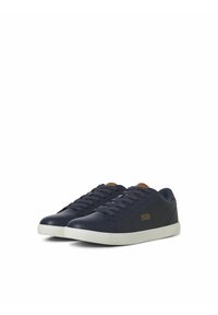 Navy leather sneakers with white rubber sole, brown leather accents, flat laces, and gold logo detailing on the side.