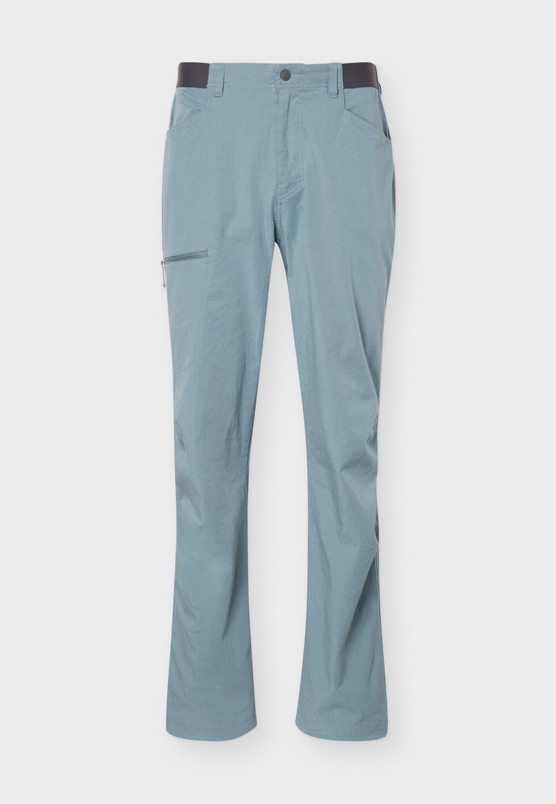 Hellblaue Hose mit schwarzem elastischem Bund, seitlicher Reißverschlusstasche am linken Oberschenkel und Vordertaschen, flach auf weißem Hintergrund liegend.