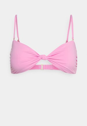 Pink bikini top with a twisted front design, adjustable thin straps, and a clasp fastening at the back. Smooth fabric with a slight sheen.