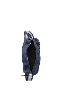 Denim shoulder bag with silver accents. Zippered closure, hexagonal patterned interior, and a blue strap with silver stripes.