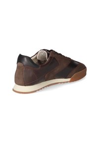 Brown suede and leather sneaker with a textured design, contrasting accents, and a rubber sole featuring a slight tread pattern.