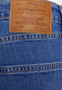 Levi's® Calças de ganga de corte afunilado - dark indigo stonewash
