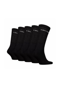 Chaussettes en coton noires, design côtelé, présentées en cinq paires, avec un détail de logo au niveau de la cheville. Texture lisse et longueur mi-mollet.