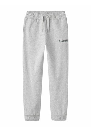 Pantalon de survêtement gris clair avec taille élastique et poignets, cordon de serrage et petit texte "IT'S MONDAY" sur la partie supérieure de la cuisse gauche.