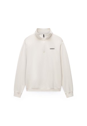 Vaalea kermaan vivahtava collegeneule korkealla kauluksella, neljänneksen mittaisella vetoketjulla ja mustalla logoyksityiskohdalla. Sileä pinta, jossa resorit hihansuissa ja helmassa.