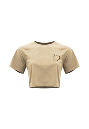 Beige cropped T-shirt met korte mouwen en een klein hartje en ring van een planeet op de linkerborst.