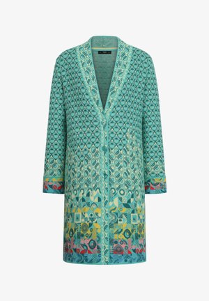 Türkoosised kudumid kardigan geomeetriliste mustritega, V-kaelus ja pikad varrukad. Omab nööbivarre ja värvilisi aktsente servas.