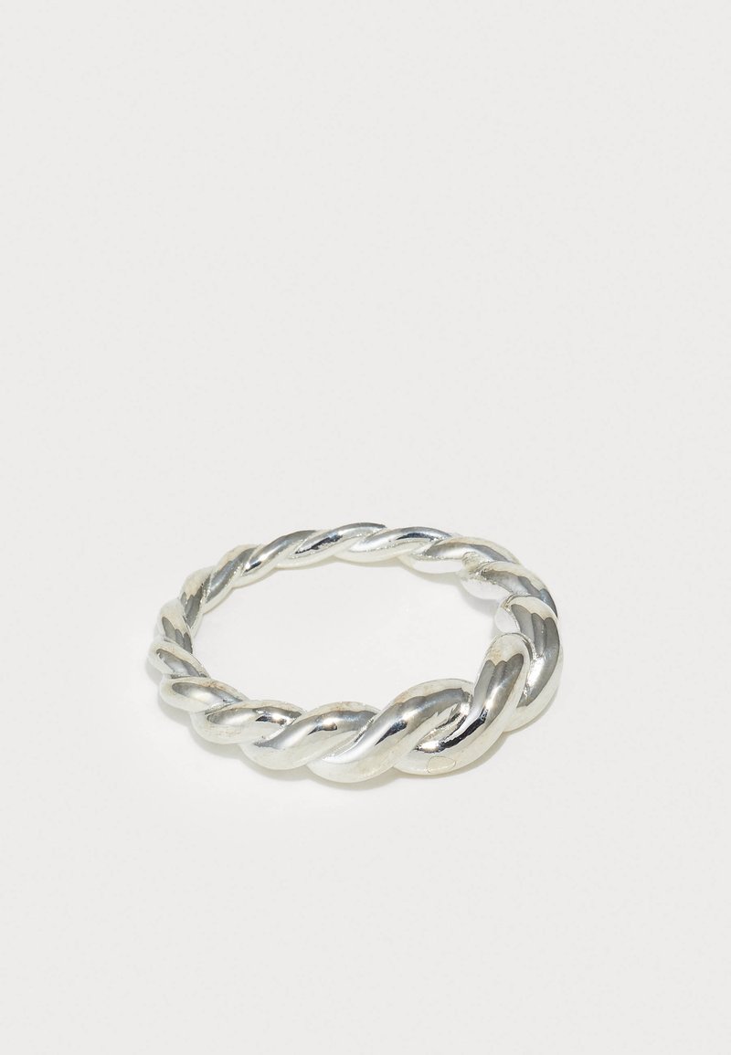Twisted silver ring featuring a polished finish, smooth texture, and rounded edges; the design showcases a continuous braided pattern.