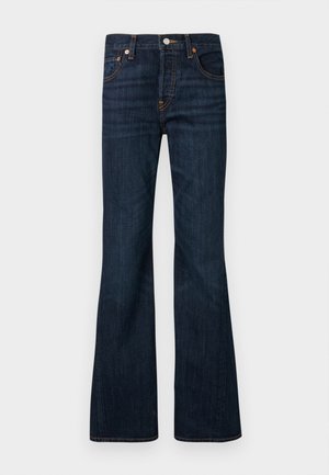 Temno modre jeans hlače iz jeansa z rahlo zvonastim spodnjim delom hlačnic, sprednjo zaponko z gumbi in zadrgo, petimi žepi ter vidnim oranžnim šivom.