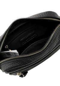 Black leather bag with a textured surface. Features a gold zipper and interior pockets. The interior is lined with a soft black fabric.