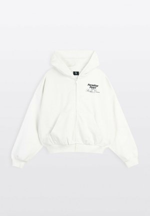 Biała bluza z kapturem na zamek, z przednimi kieszeniami i kapturem, z czarnym tekstem „Paradise Pearl” i „Pacific Ocean” na lewej piersi.