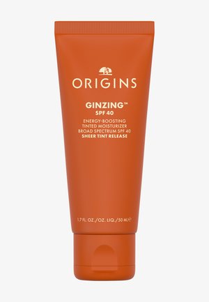 Tube de crème hydratante teintée Origins GinZing SPF 40, énergisante, écran solaire large spectre SPF 40, tenue légère, 50 ml emballage orange.