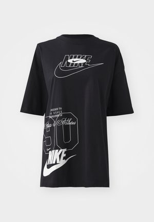 Black cotton t-shirt with short sleeves, featuring white Nike logos and text, including "90" and "Engineered to the exact specifications of sports & athletes."