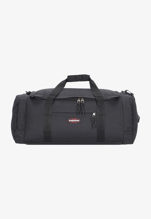 Czarna torba sportowa wykonana z trwałego materiału, z dwiema rączkami, zamkiem błyskawicznym i regulowanym paskiem na ramię. Logo Eastpak z przodu.