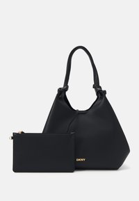 Black leather tote bag with a textured finish and a detachable zipper pouch. Features gold hardware and knotted handles.