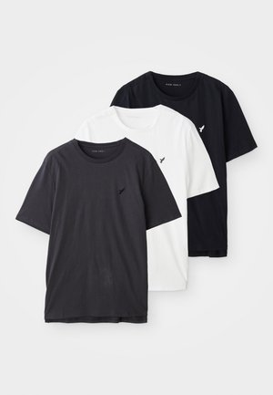 Kolme lühikeste varrukatega T-särki mustas, valges ja tumes hallis puuvillas, millel on väike logo vasakul rinnaku piirkonnas. Lihtne disain ja sobivus.