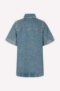 Light blue short-sleeve denim shirt with a pointed collar, contrasting stitching, and a slightly loose fit. Back view shows a smooth texture.